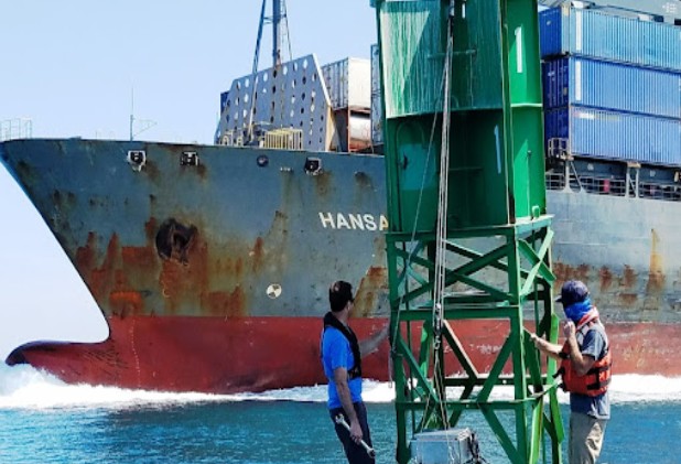 NOAA CO-OPS field team servicing a buoy-mounted current meter off PortMiami