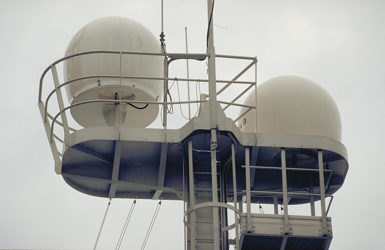 Twin Inmarsat antenna domes on the mast of a research vessel
