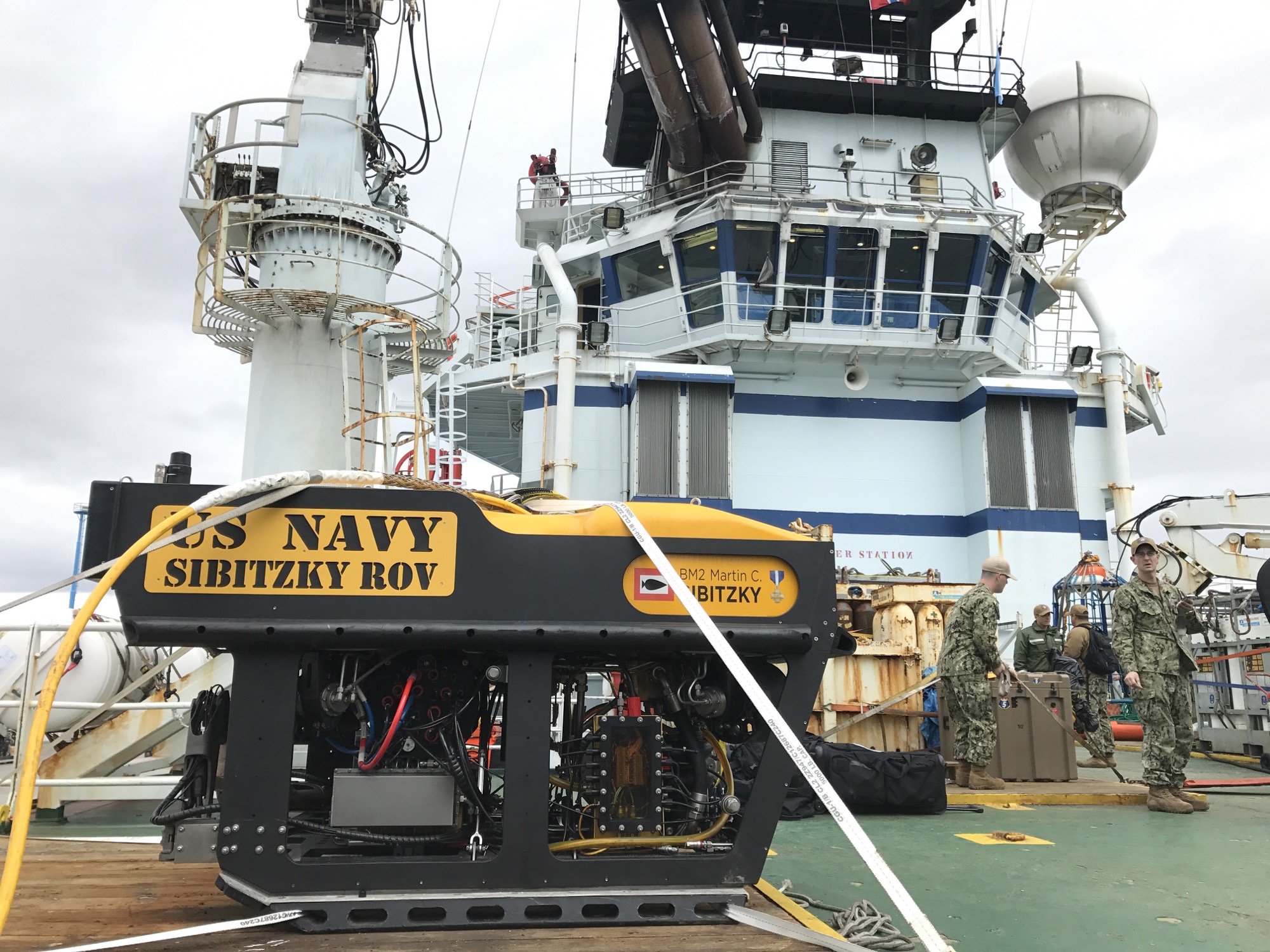 U.S. Navy remotely operated underwater vehicle staged on a support vessel deck