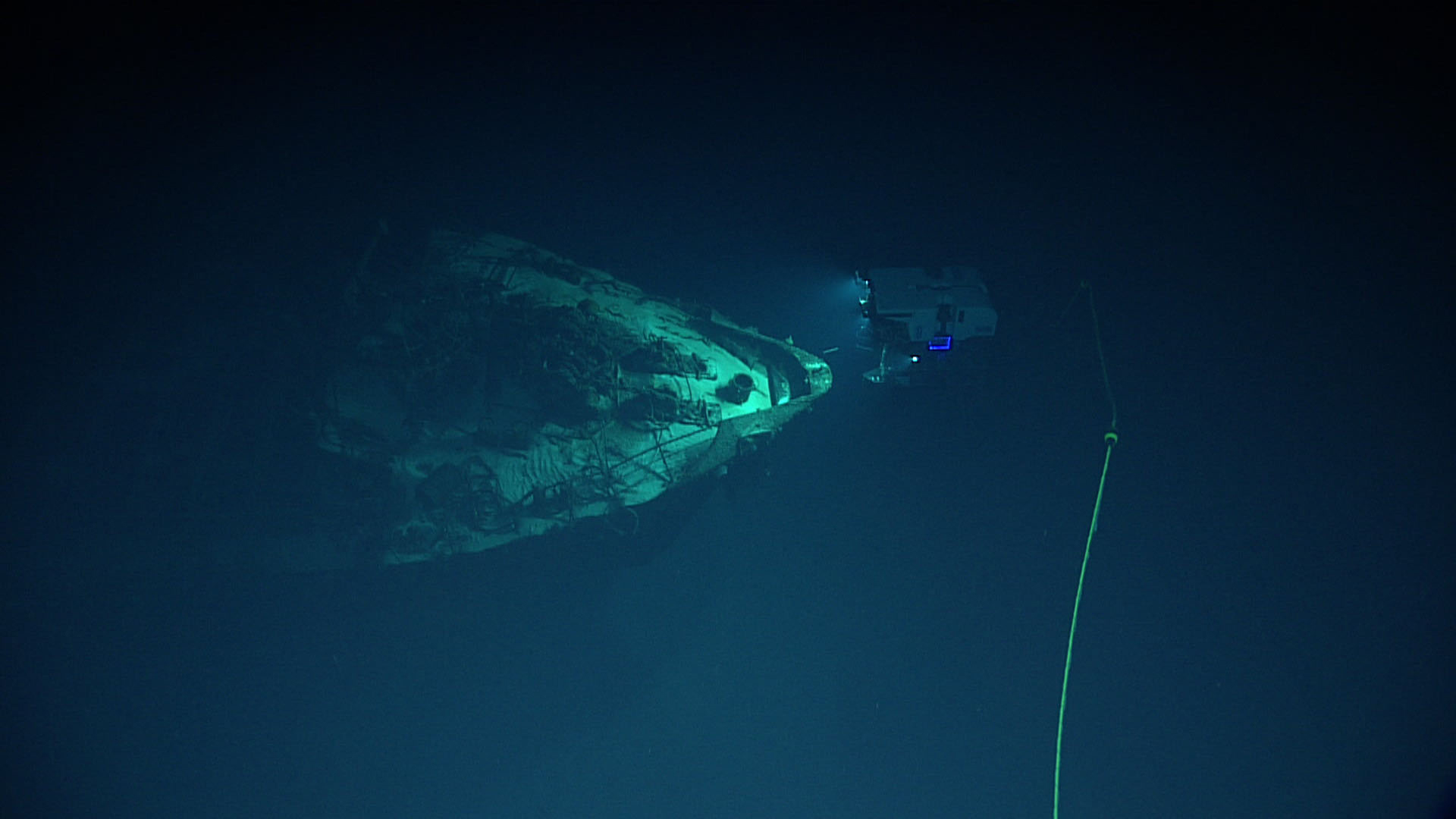NOAA Deep Discoverer remotely operated vehicle illuminating a shipwreck underwater