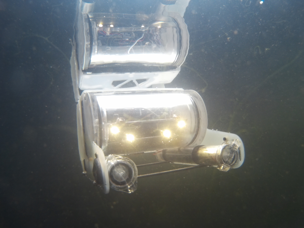 An OpenROV frame with thrusters during a river trial