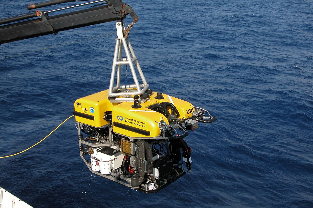 Work-class ROV Hercules on deck, tether and frame visible, not inside an aquaculture pen