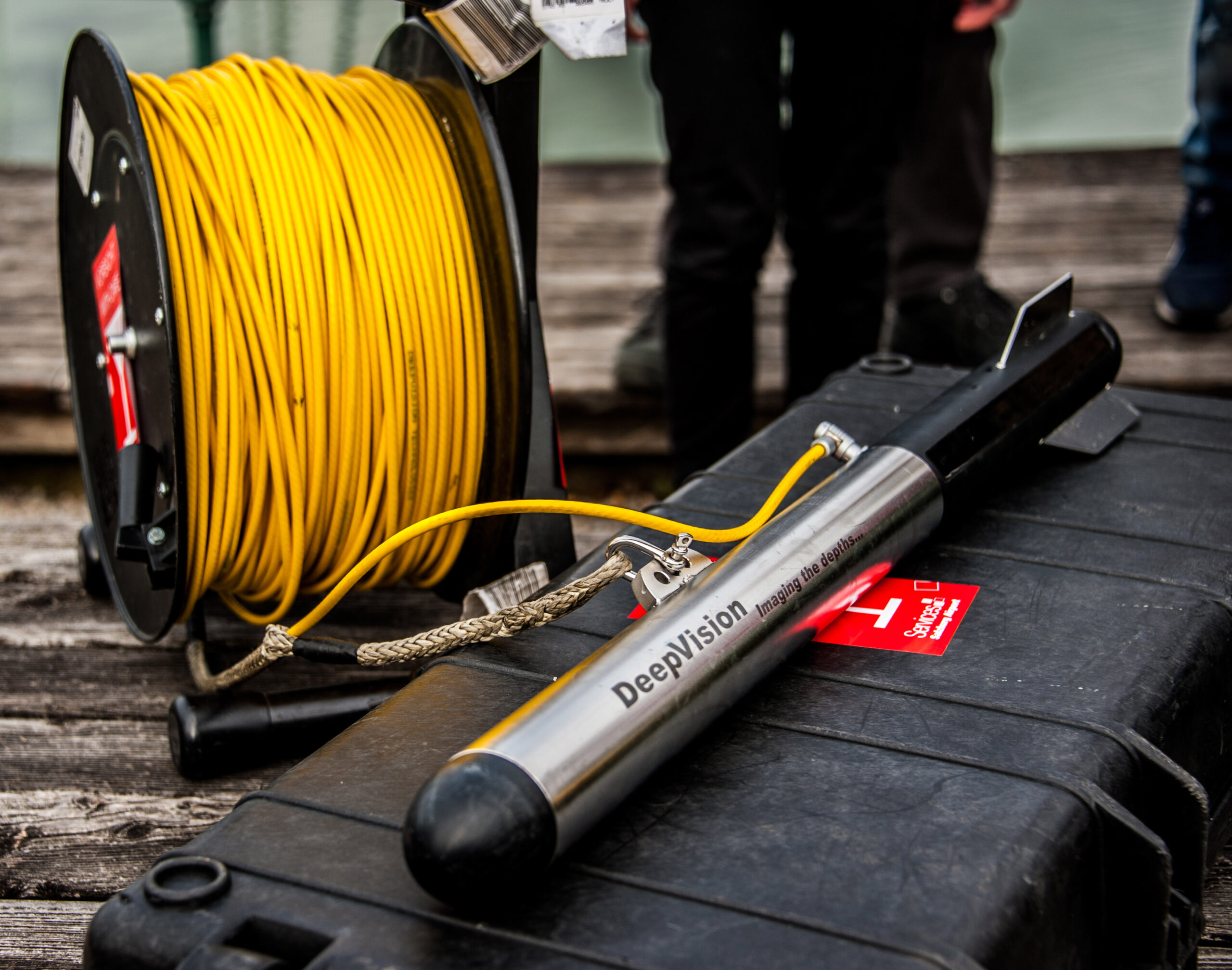 Side-scan style sonar hardware used to build a picture of the bottom from acoustic returns to the side, not a single depth number.