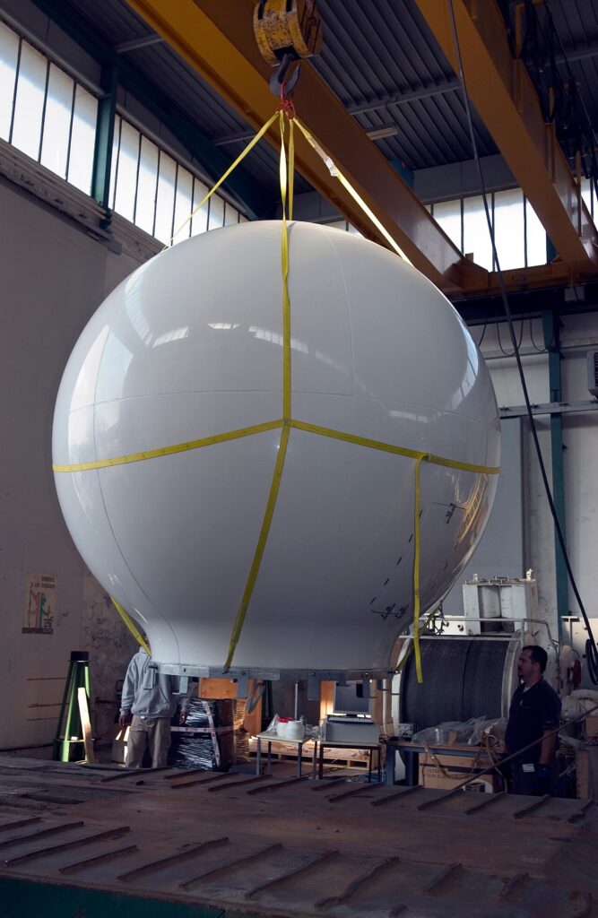 Large ship VSAT antenna being transported on a cradle, not a consumer flat-panel terminal