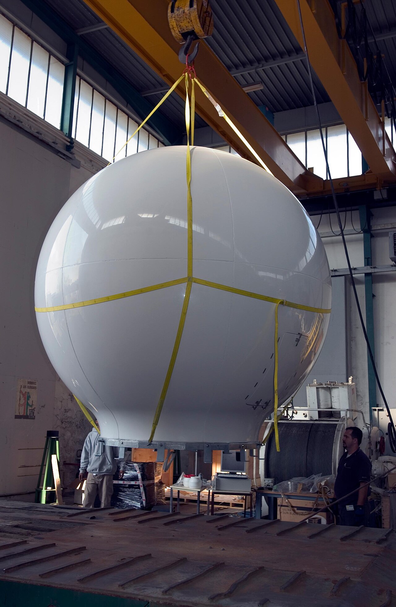 Large ship VSAT antenna being transported on a cradle, not a consumer flat-panel terminal