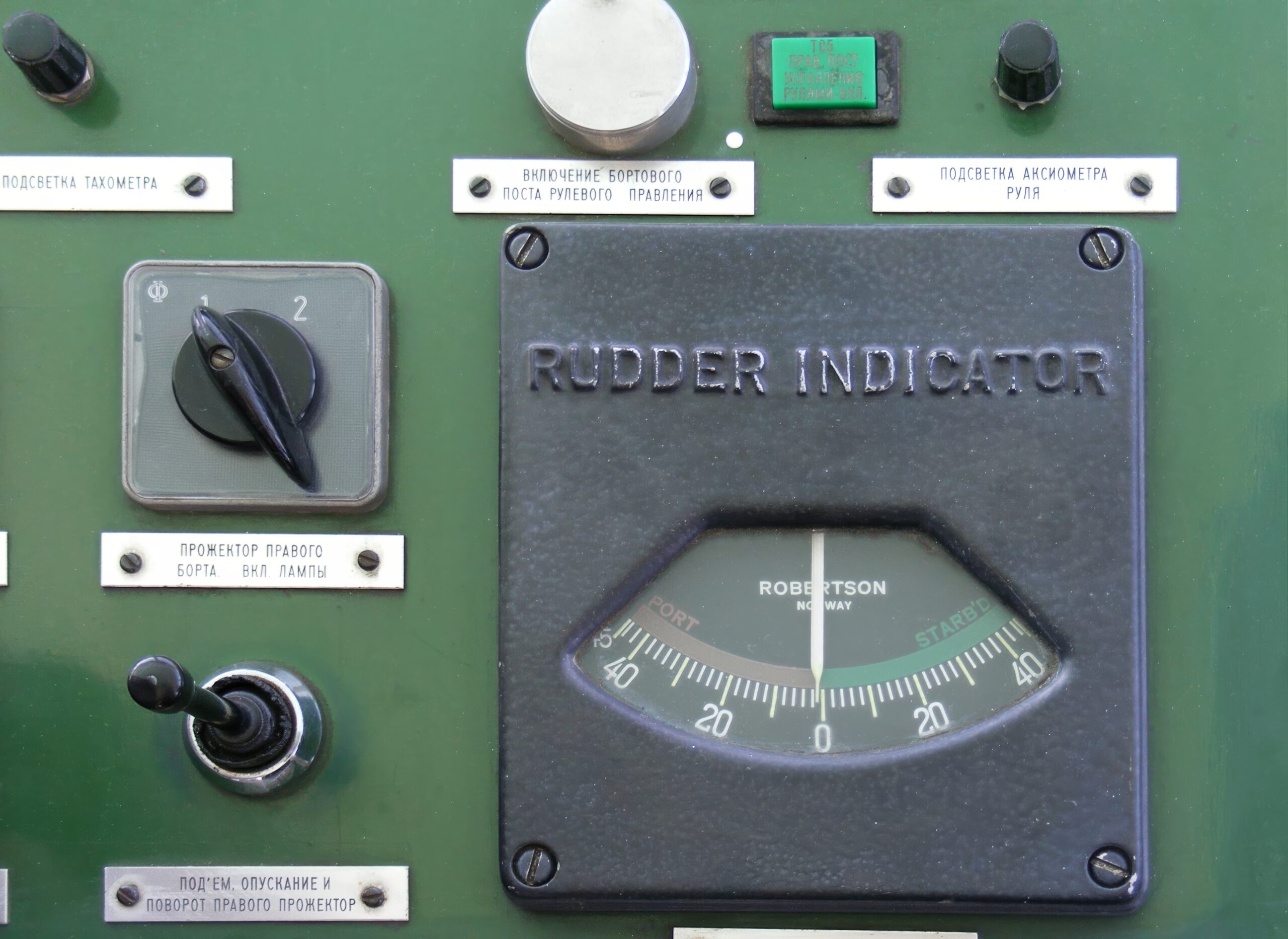 Wheelhouse helm panel with dials and switches for ship bridge instruments